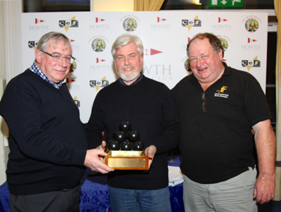 Roy Glynn (centre) is presented the Liam McGonagle Brass Monkey Trophy from Pat Connolly and David Appleyard