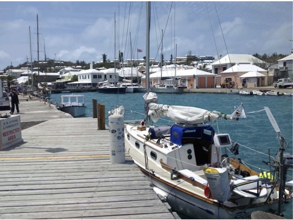 Blue Caribbean alongside Customs Dock, Ordnance Island, Bermuda Town of St. George's in the background. Bermuda Radio on the hill behind to the left.