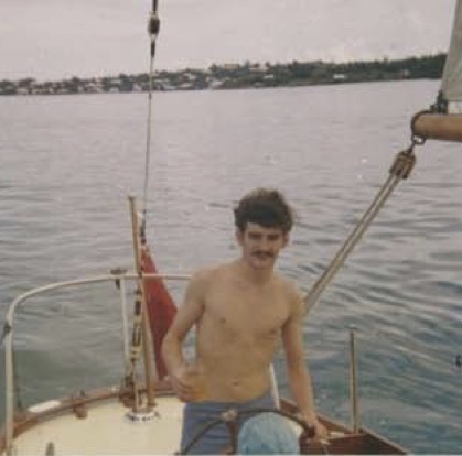 Rum & ginger and a smoke at the wheel in Hamilton Harbour 1969 (right) - Sail training was tough in those days.