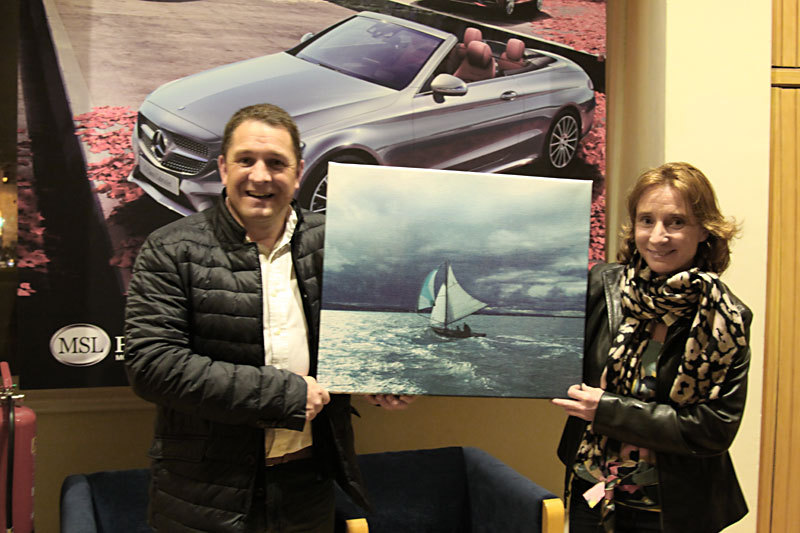 Jonathan Wormald presents Sinead Harte with a canvas mounted print of her winning photo - Sinead also won a week-long test drive of one of MSL Park Motors Mercedes-Benz cars