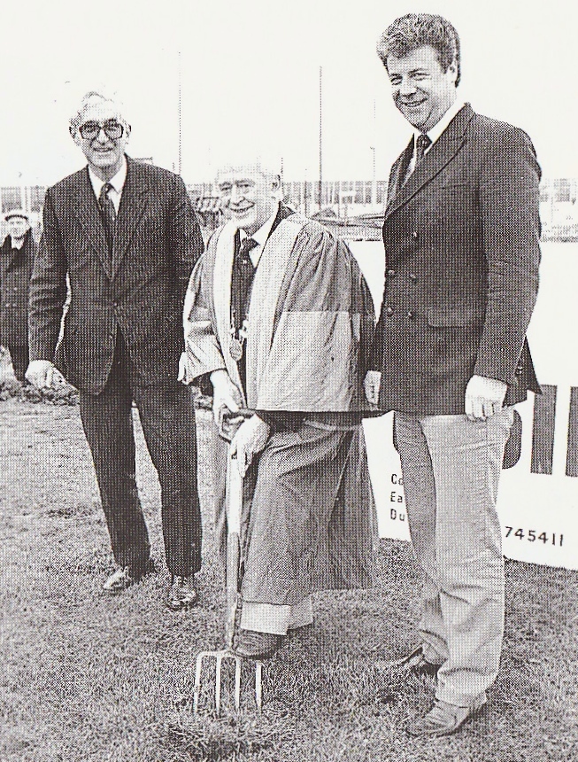 The building work finally starts. At the turning of the first sod on November 23rd 1985 are (left to right) Lyall Collen of contractors Collen Brothers, lifeboat cox’n Gerry McLoughlin in his role as Lord Mayor of Howth, and HYC CommodoreTom Fitzpatrick.