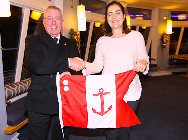 Rear Commodore Sara Lacy receives her flag