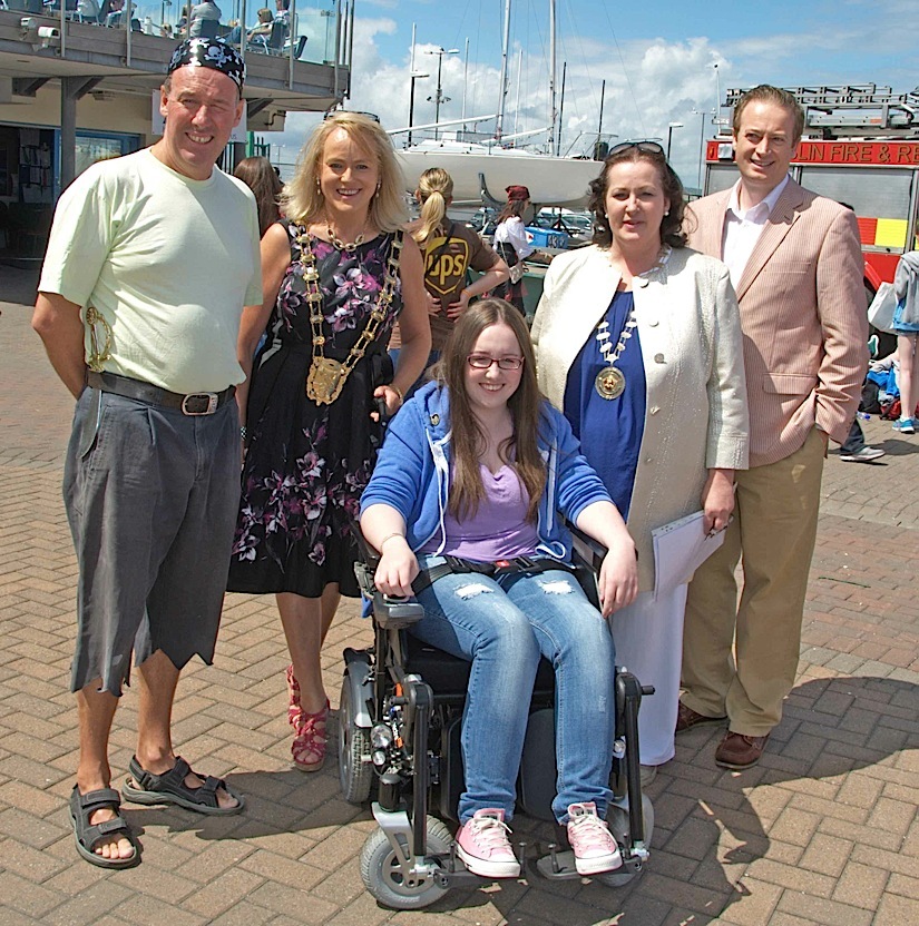 The Commodore, Mayor, Chief Barker of Variety and Fingal Councillor Keith Redmond with Naomi in her newly presented wheelchair