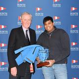 Commodore presents Bhorat Mohan with Instructor of the Year award