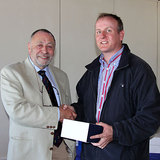 Michael_O'Connor_(Sin_Bin)_collects_his_prize_from_Rear_Commodore_Joe_Carton.jpg