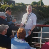 Chris_a_crew_member_distributing_sun_cream_lotion_and_bottles_of_water..JPG